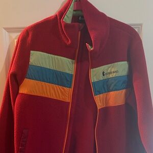 cotopaxi Red Fleece Jacket with Green, Blue & Orange Panels